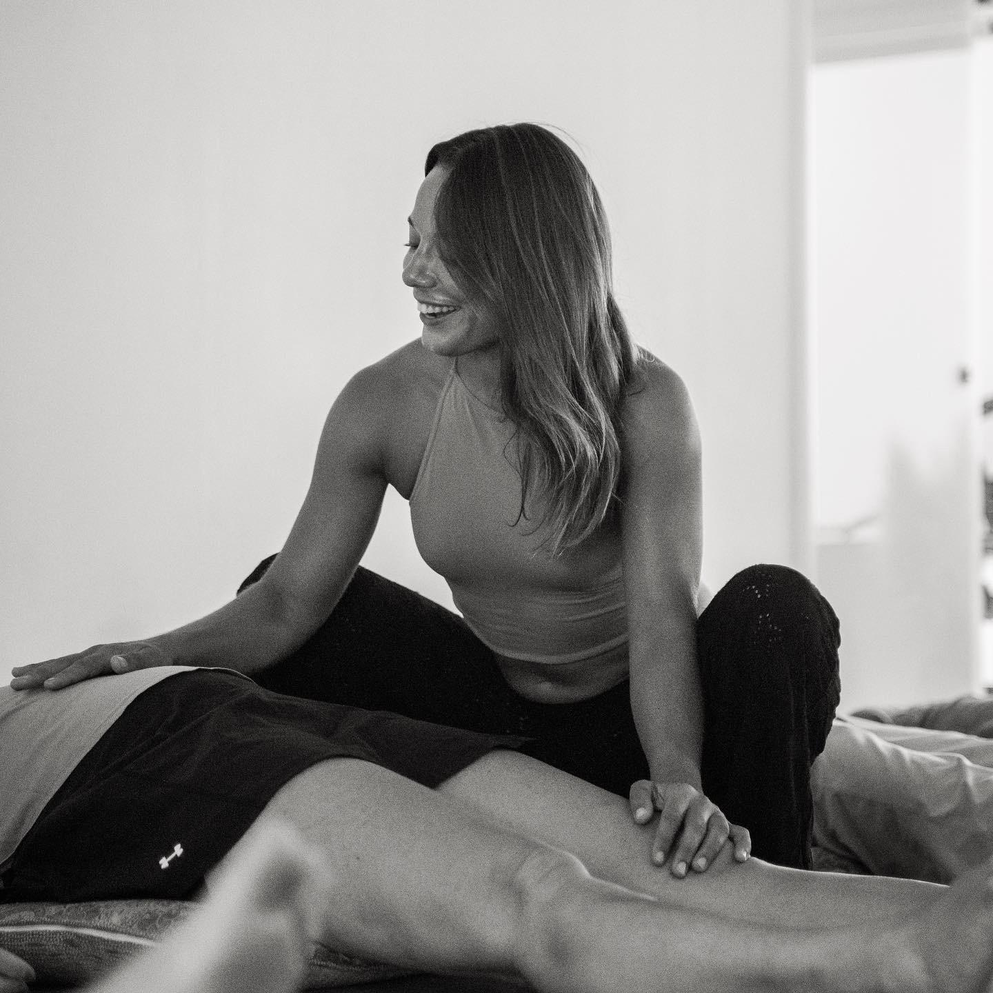 A practitioner giving a bodywork session